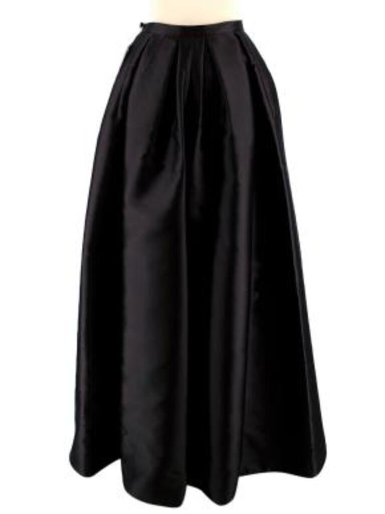 Dior Black Silk Asymmetric Pleated Full Skirt
 

 -zip pocket
 -zip front
 -pleated at waist band 
 -concealed clip front
 -Tiered front 
 -double lined
 

 Material
 71% silk
 29% polyester
 

 Washing
 Dry clean
 

 MADE IN FRANCE 
 

 PLEASE