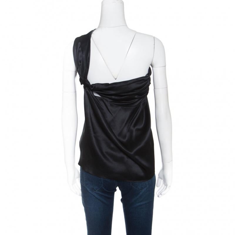 This top from Dior is one item your closet will love. Tailored from quality silk, it has a gorgeous draped detail in a one-shoulder style, lending it an elegant touch. Bound to look great with pants as well as skirts, this black number is a