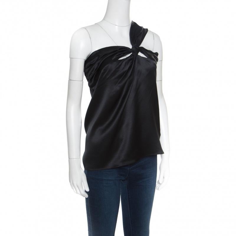 This top from Dior is one item your closet will love. Tailored from quality silk, it has a gorgeous draped detail in a one-shoulder style, lending it an elegant touch. Bound to look great with pants as well as skirts, this black number is a