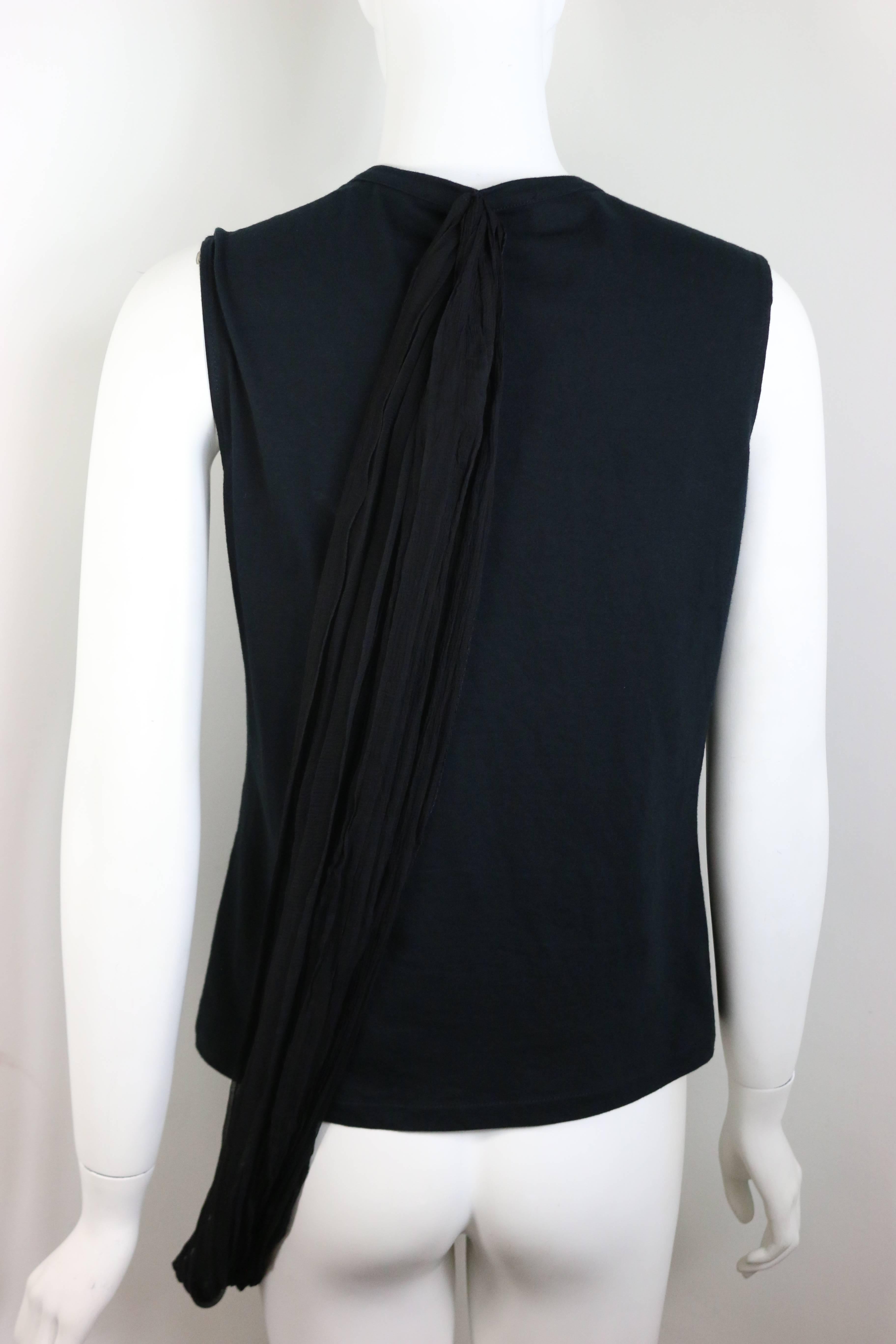 - Dior black tank top from early 2000s John Galliano. Featuring a black silk wrapping details connected from the bottom front to the bottom back. You can also play around the wrap the way you want wrapping around your body. 

- Size 42 FR, USA 10.