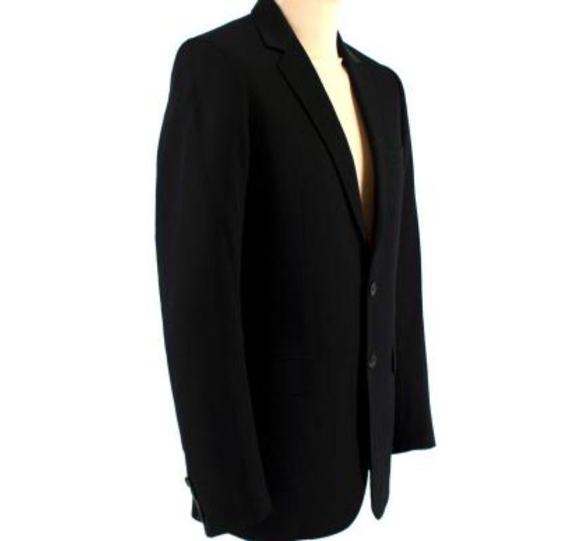 Dior Black Single Breasted Blazer

- Two buttoned front
- Single breasted
- Padded shoulders
- Welt chest pocket
- 4 interior pockets
- Vent in the back
- Buttoned cuffs
- One broken button

Material
100% wool
Lining: 100% Bemberg

9.5/10 Excellent