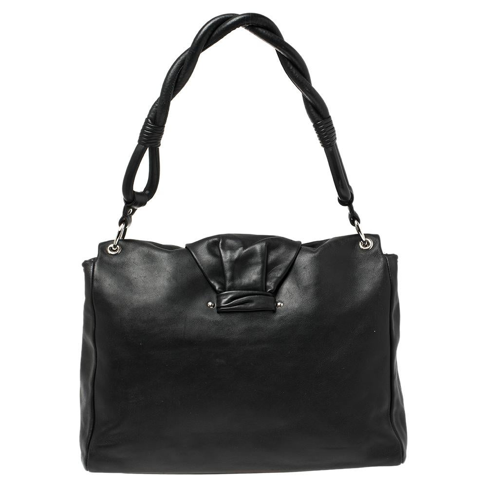 You definitely need to get your hands on this exemplary Demi Lune bag from Dior! The black creation is crafted from leather and features an artistic silhouette. It flaunts a front flap closure that is detailed with a ruched strap carrying an