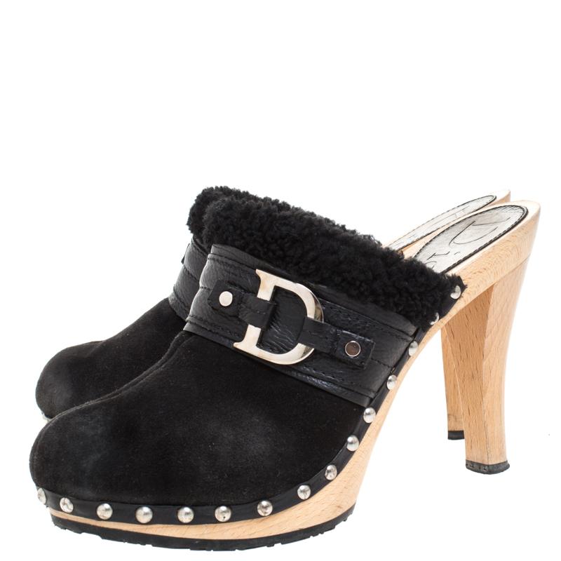 These stylish and sophisticated clogs come from the iconic house of Dior. They are crafted in Italy and made of quality suede, leather and shearling. They are styled with round toes, the brand's initial in silver-tone on the uppers that enhance the