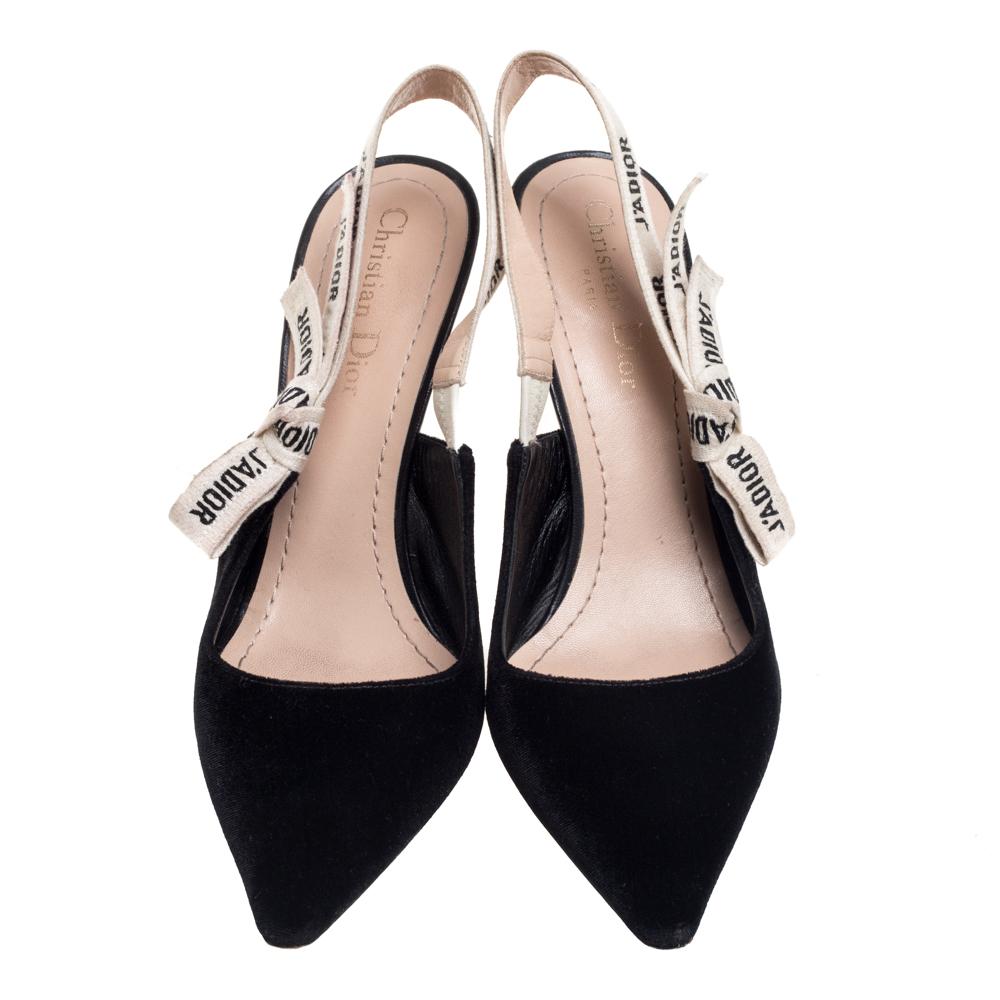 Endless compliments will come your way every time you wear these Dior pumps. The black pumps are crafted from suede and styled with pointed toes and J'adior ribbon slingbacks. They are complete with comfortable leather insoles and 10.5 cm
