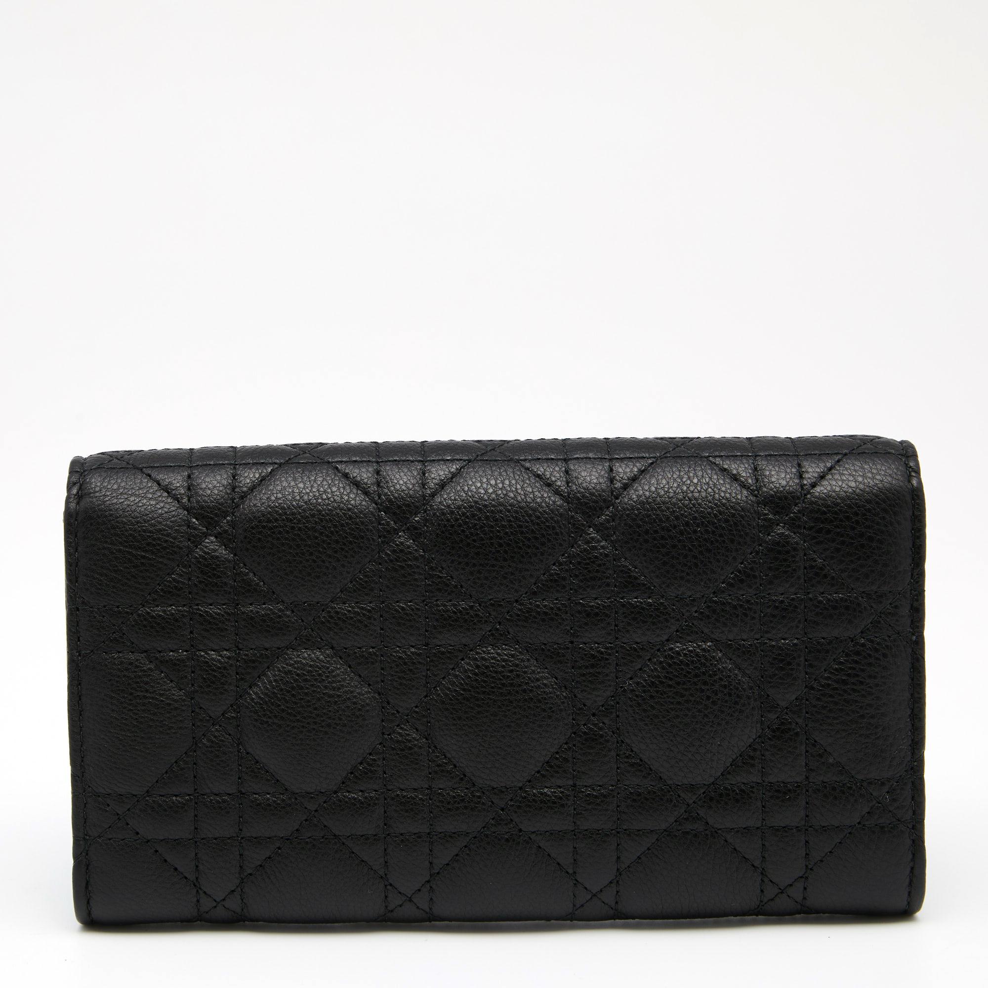 With timeless elegance, this Dior wallet is made noteworthy with the Cannage pattern on its black exterior. Its fabric and leather lined interior is equipped with different compartments to safely store your monetary essentials. Created from leather,