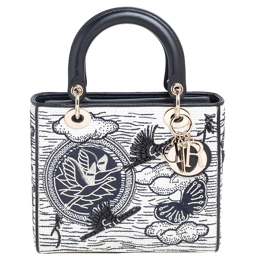 A timeless status and great design mark the Lady Dior tote. It is an iconic bag that people continue to invest in to this day. We have here this classic beauty crafted from woven leather and decorated with beads and embroidery. The bag has a lined