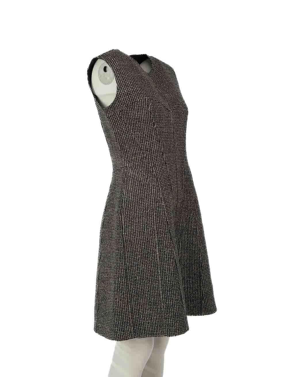 CONDITION is Very good. Hardly any visible wear to dress is evident however neck label has come partially unstitched on this used Christian Dior designer resale item.
 
Details
Black
Wool
Dress
Round neck
Sleeveless
Mini
2x Side pockets
Back zip and