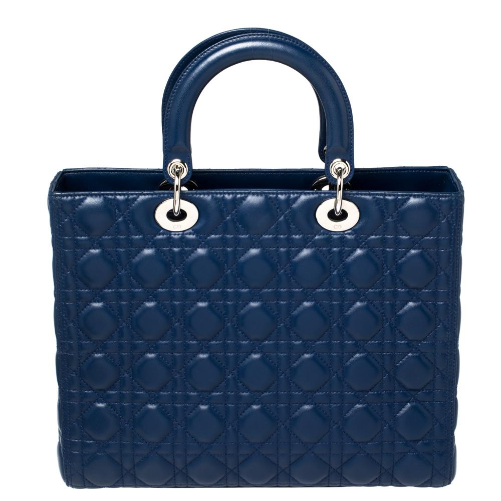 The Lady Dior tote is a Dior creation that has gained recognition worldwide and is today a coveted bag that every fashionista craves to possess. This blue tote has been crafted from leather and it carries the signature Cannage quilt. It is equipped