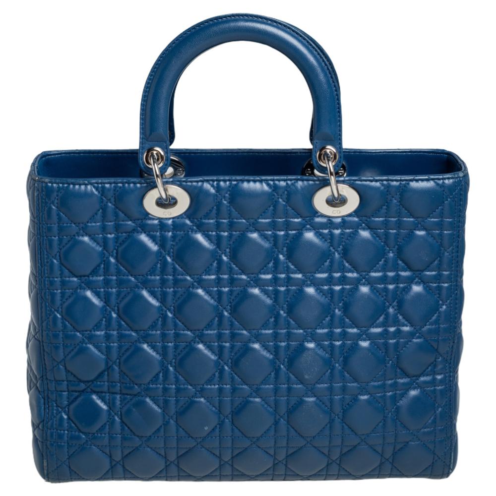 The Lady Dior tote is a Dior creation that has gained recognition worldwide and is today a coveted bag that every fashionista craves to possess. This blue tote has been crafted from leather and it carries the signature Cannage quilt. It is equipped
