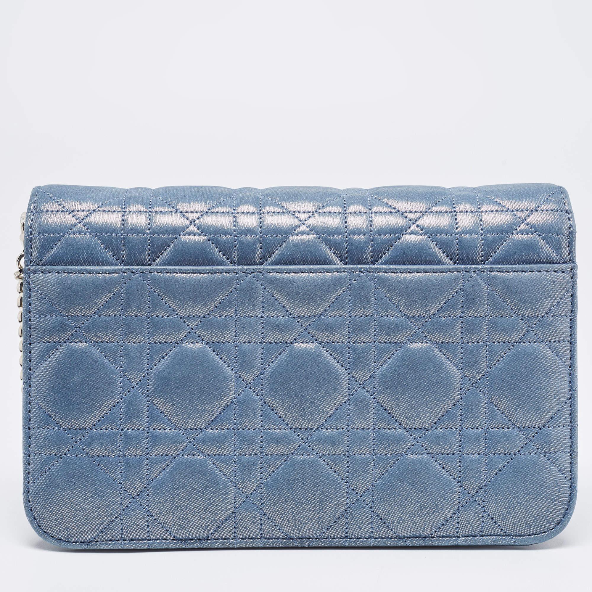 This creation from Dior is so pretty it will surely make a fine buy. Crafted from leather, this Miss Dior Promenade clutch features their signature Cannage quilt all over. The front flap has a Dior lock that opens to a leather-nylon lined interior