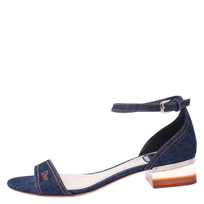 Look stylish no matter what you wear with these beautiful denim sandals. Elevate the charm of your outfit with this blue pair. These chic sandals by Dior feature single front straps, buckled ankle straps and low block heels.

Includes: The Luxury