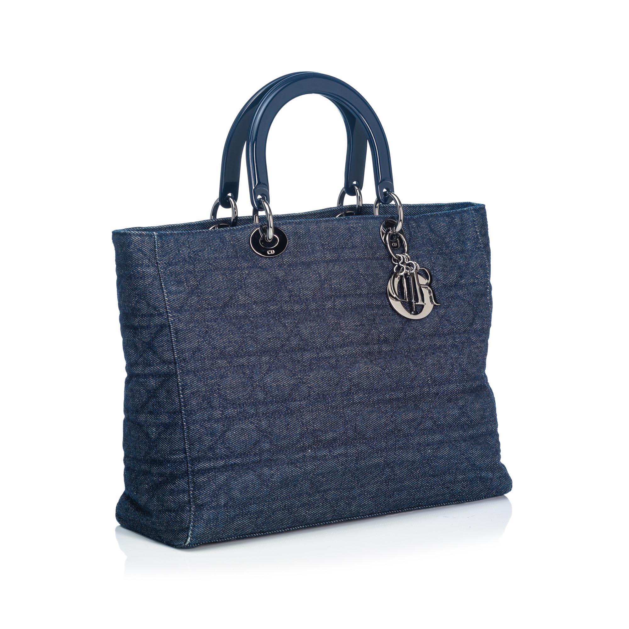 The Lady Dior features a cannage denim body, rolled patent leather handles, a top zip closure, and interior zip and open pockets. It carries as B+ condition rating.

Inclusions: 
Dust Bag

Dimensions:
Length: 25.00 cm
Width: 33.00 cm
Depth: 12.00