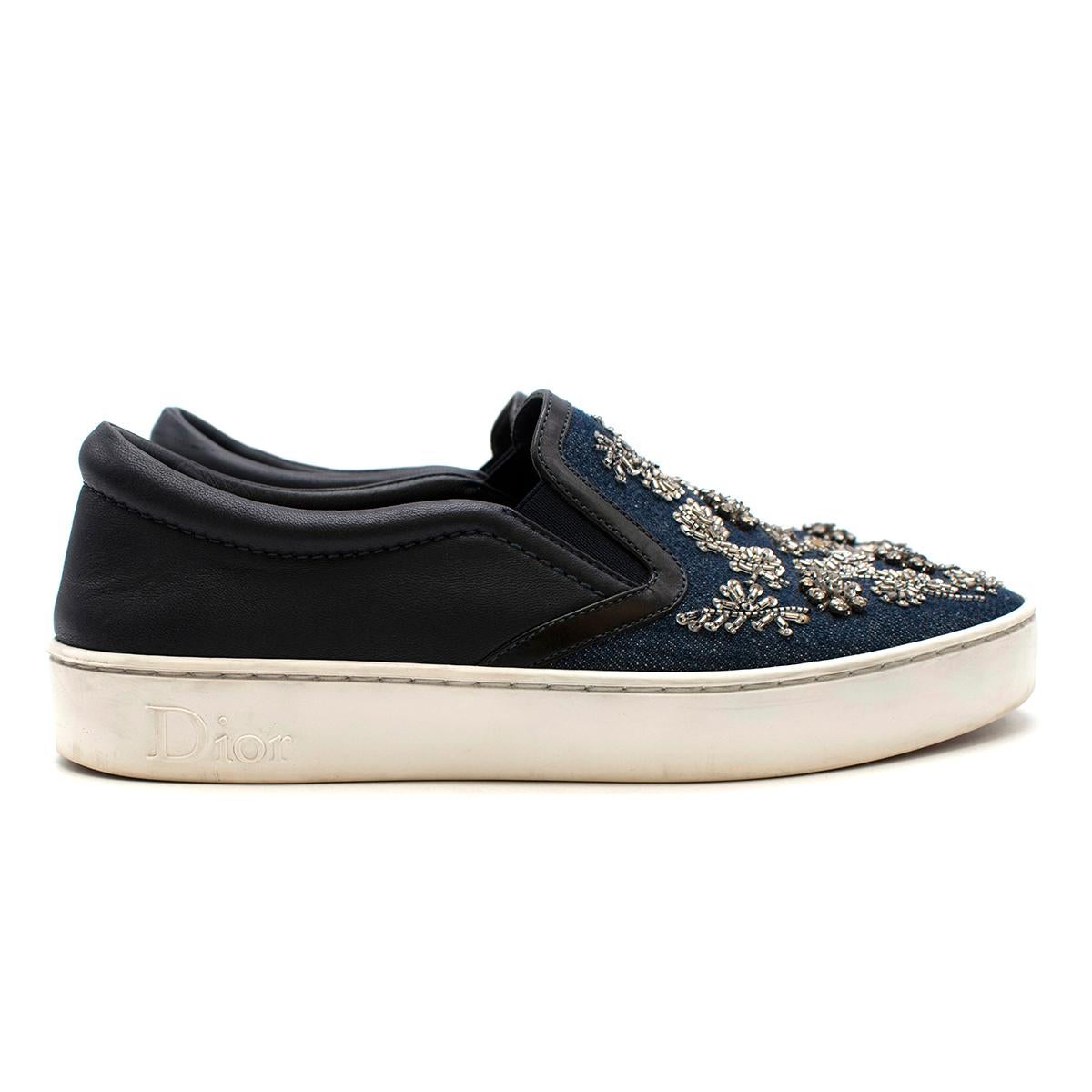 Dior Blue Denim Embellished Slip-on Trainers 

To accompany your attires with ultimate style, Dior brings you this pair of sneakers that speak nothing but fashion and comfort. They've been crafted from indigo dark wash denim with leather trims and