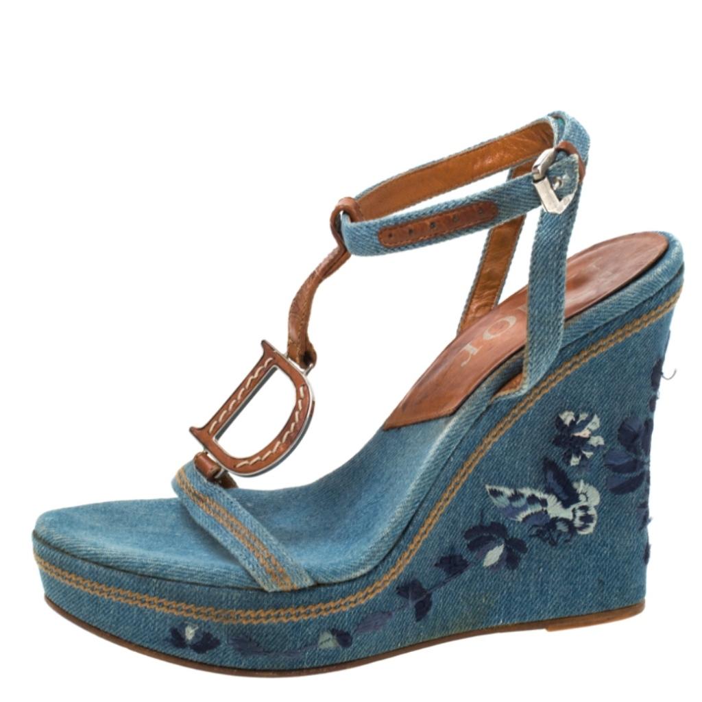 Keep it casual and chic with these denim fabric sandals. With a strong and durable leather sole and high embroidered wedges, these uber-stylish pair is perfect for any season. These chic sandals by Dior carry signature D motif on the t-strap and are