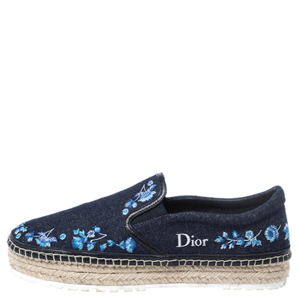 Continue to be your fashionable self even in your casuals by owning these espadrille loafers from Dior. They've been crafted from blue denim, feature leather trims. They are styled with little embroidered florals and braided details on the midsole.