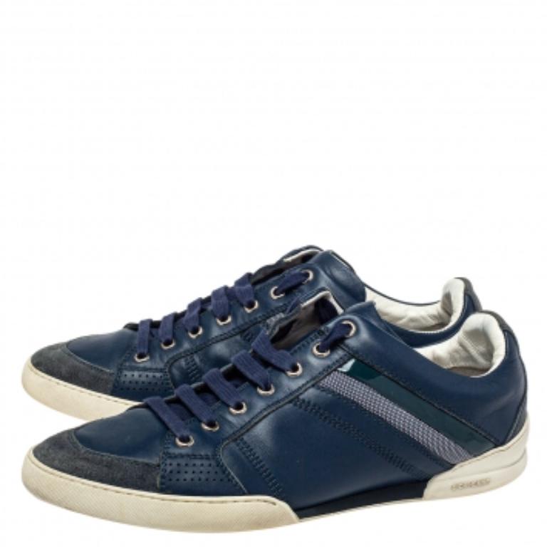 These low-top sneakers from Dior are amazingly stylish! They are crafted from canvas, patent leather, leather, and suede, featuring laces on the vamps, round toes, and 'CD' logo detailing on the counters. Wear them for casual outings and get