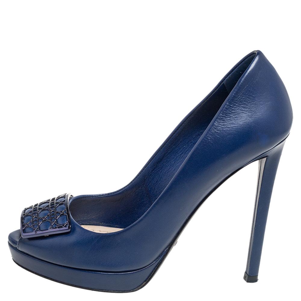 Bring back the retro look by flaunting this pair of pumps, designed from leather. This pair of pumps from Dior showcases fine design and exquisite craftsmanship. The blue pumps feature peep toes, 11.5 cm heels, and a Cannage plaque detail on the
