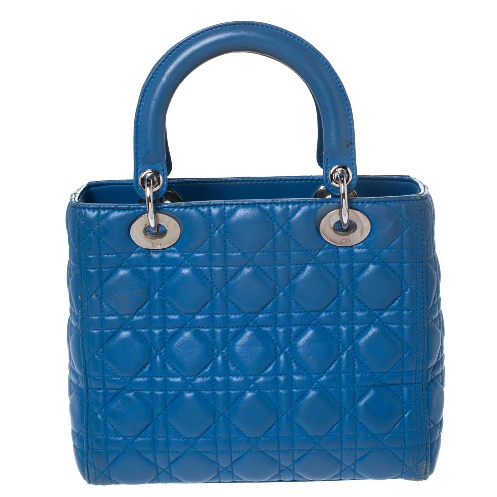 The Lady Dior tote is a Dior creation that has gained recognition worldwide and is today a coveted bag that every fashionista craves to possess. This blue tote has been crafted from quality leather and it carries the signature Cannage quilt. It is