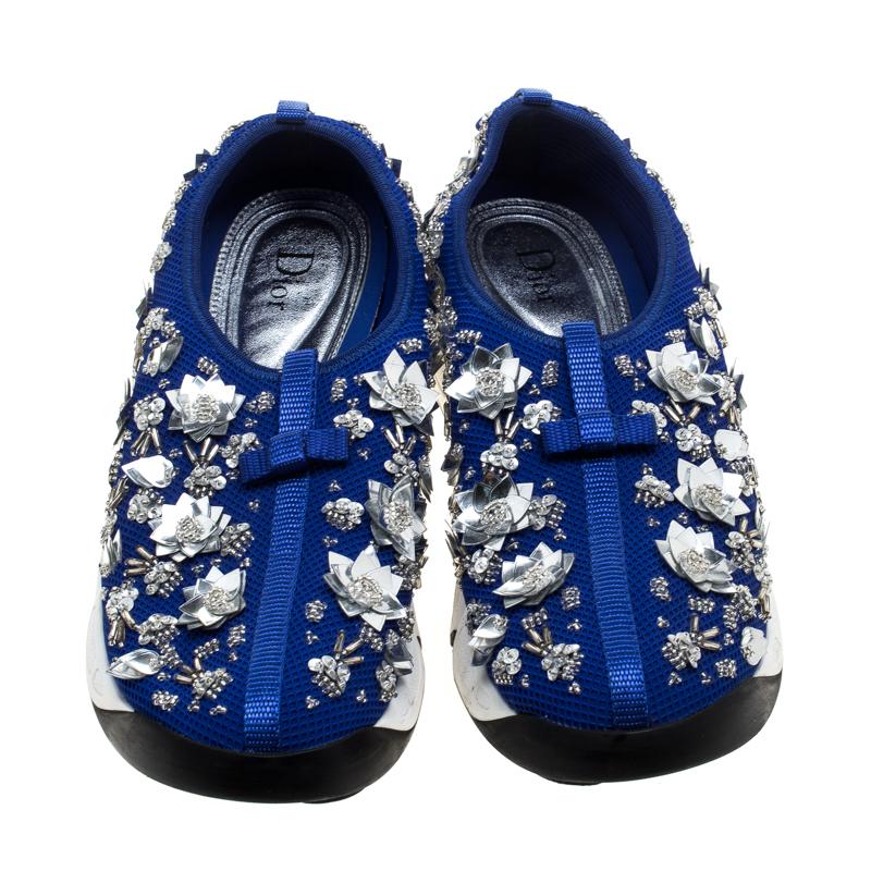 These Dior Fusion slip-on sneakers styled with a blue mesh exterior will keep you comfortable with a feminine glam style. Featuring beautiful floral embellishments all through the surface, these shoes are complete with rubber soles that are detailed