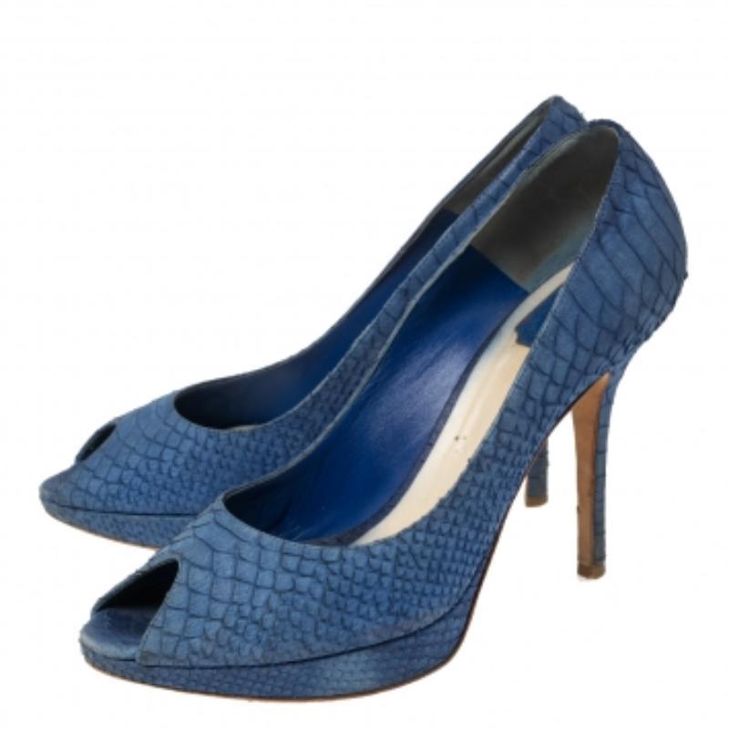 The Miss Dior collection from Dior is a significant creation that continues to attract everyone with its impeccable style. These Miss Dior pumps are created from python-embossed leather and feature peep-toes, platforms, and high heels. Step out