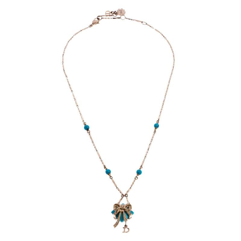 Dainty and elegant, this necklace from Dior is a versatile beauty that can be worn to any occasion. This necklace features a gold-tone chain that holds beads and a pendant that looks like a wrapped present. Gift yourself this piece today!

Includes: