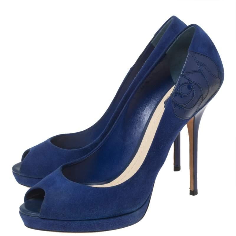 The Miss Dior collection from Dior is a significant creation that continues to attract everyone with its impeccable style. These Miss Dior pumps are created from suede and feature peep-toes, platforms, and high heels. Step out boldly as you wear