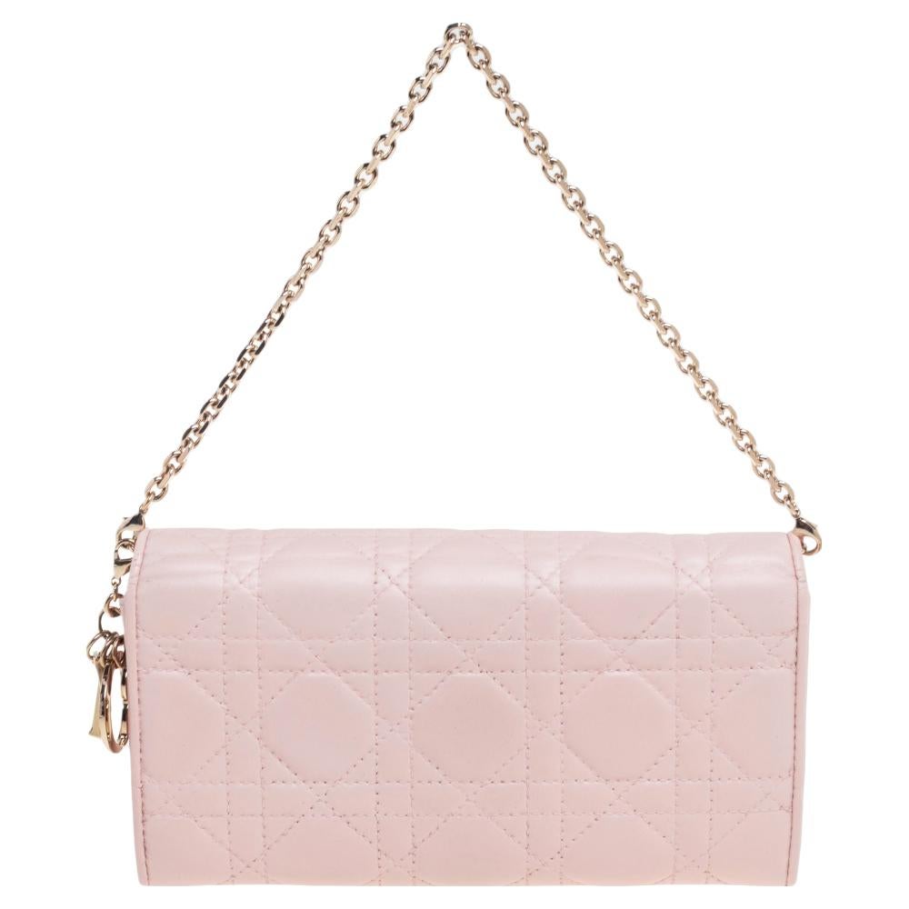 Designed to perfection using Cannage leather, this Lady Dior wallet-on-chain can be your go-to accessory. Bringing elegance and convenience to your everyday style, this blush pink creation from Dior has a well-lined interior, a chain handle, and