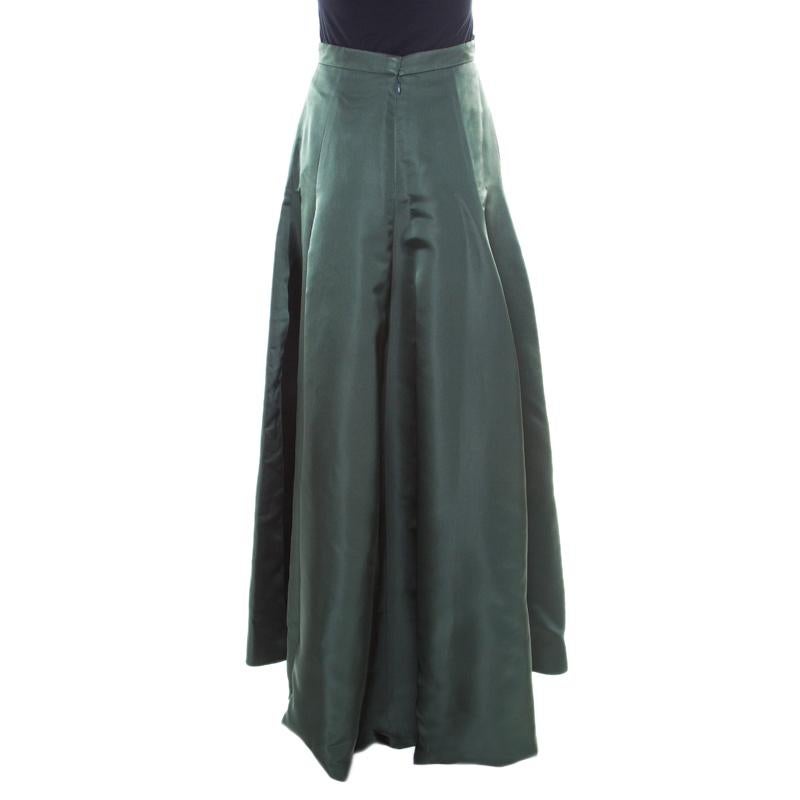 Adopt a magic touch of grace and feel like a diva with this Dior skirt. Tailored from silk, the bottle green skirt has a flared silhouette and a high waistline. A perfect blend of elegance and style is this classy creation.

Includes: The Luxury
