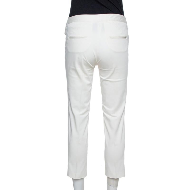 Cropped pants will never go out of style so get your hands on these ones from Dior Boutique! The off-white pants are made of a cotton blend and have been styled with front flap pockets and back slip pockets. Sure to lend you a fantastic fit, they