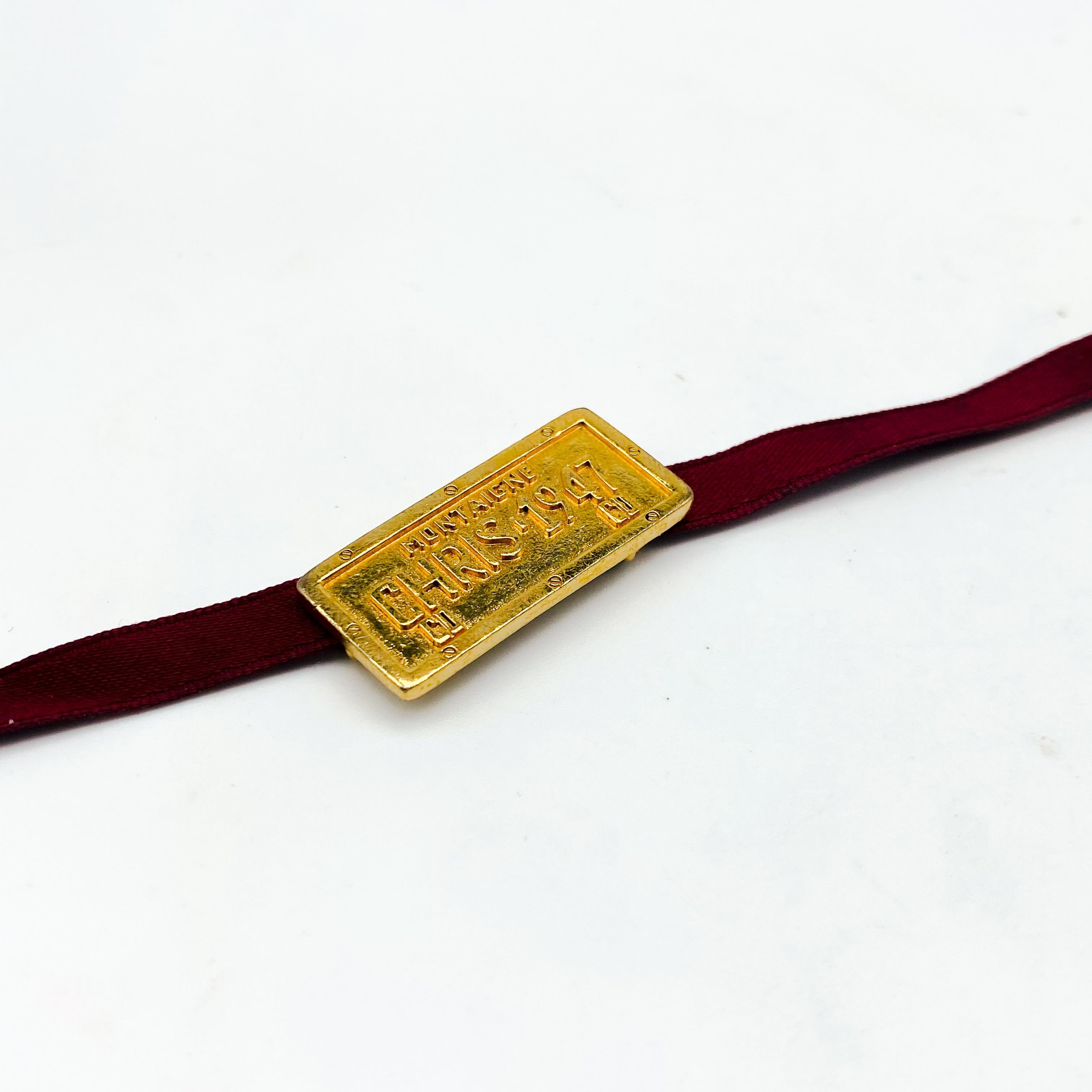Dior Vintage Y2K Bracelet

Amazing Galliano era Y2K Dior bracelet, featuring a rich red ribbon strap with a gold plated number plate - embossed with 