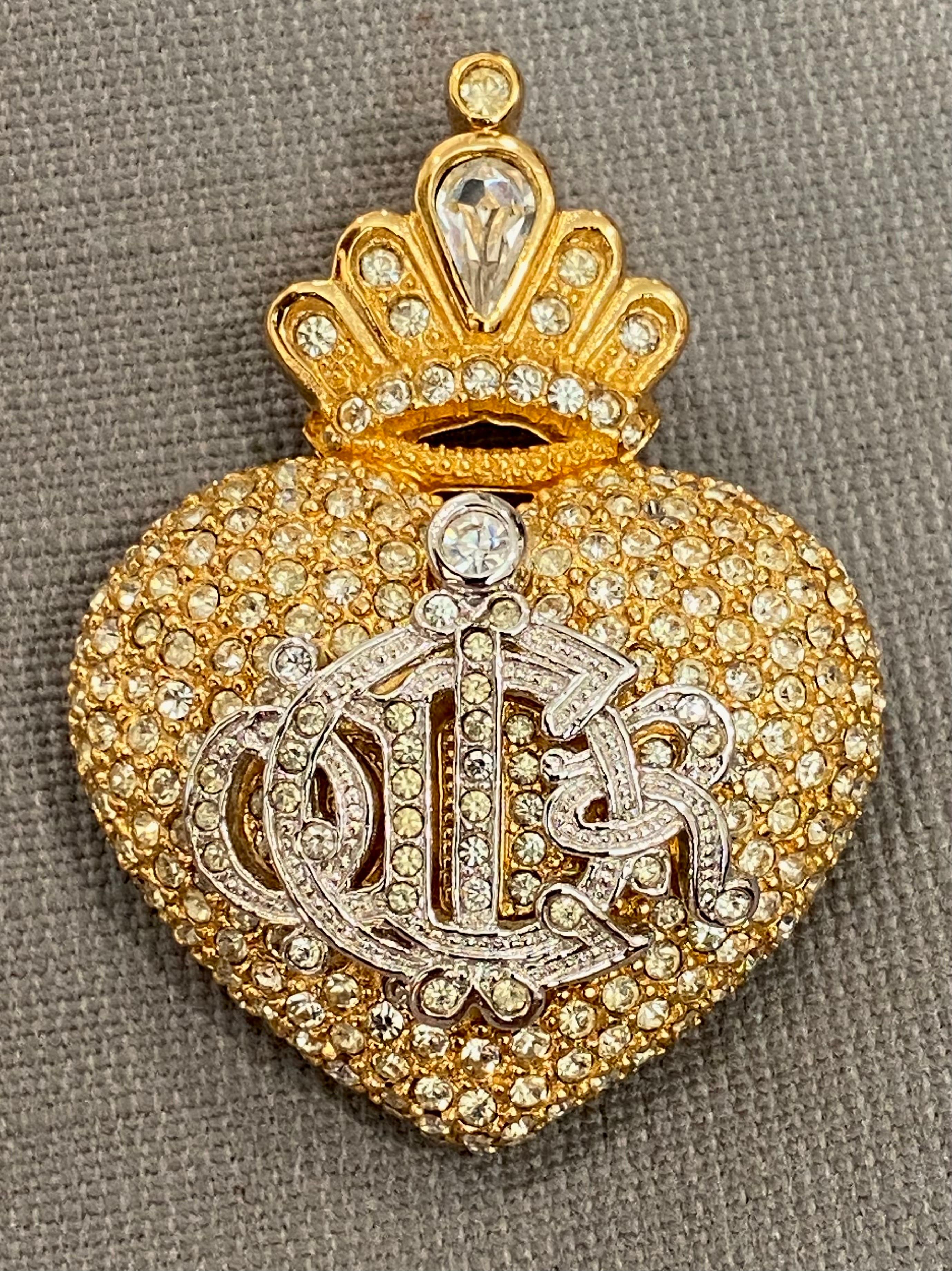 Presented is a wonderful Christian Dior heart brooch brooch  from the Pret-a-Pieter Autumn-Hiver 1992. It was crafted by the renowned jewelry company Henkel & Grosse’. Henkel & Grosse’ has a long-standing partnership with Christian Dior, spanning