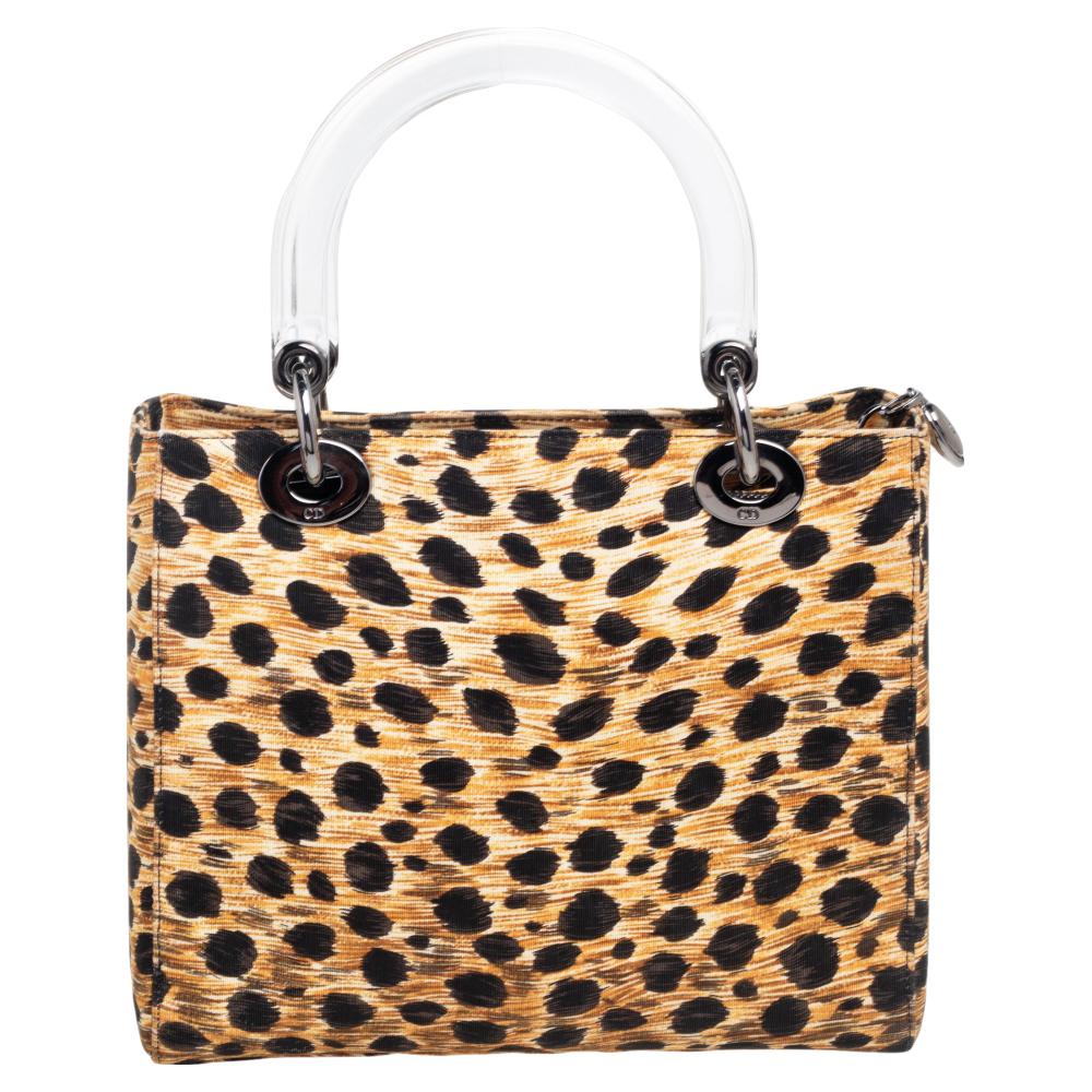 The Lady Dior tote is a Dior creation that has gained recognition worldwide and is today a coveted bag that every fashionista craves to possess. This tote has been crafted from animal-printed fabric and it is equipped with a fabric interior and two