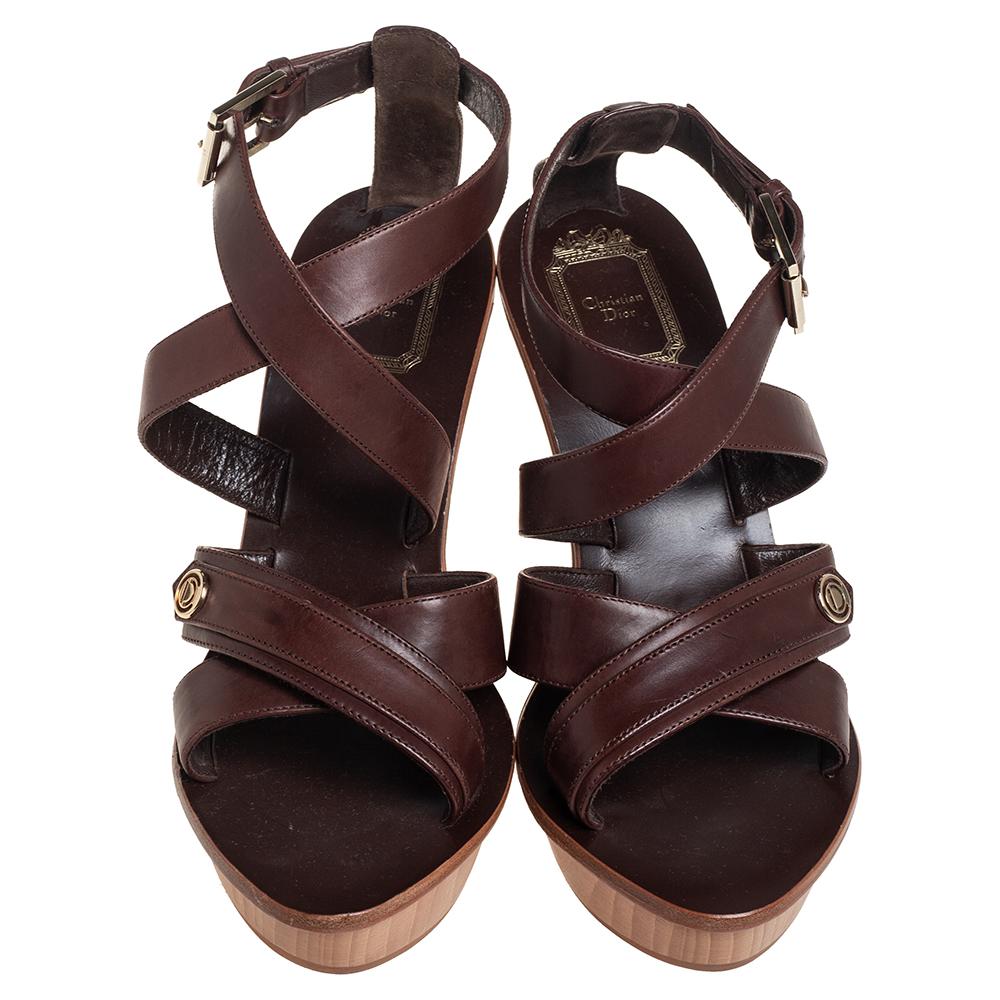 A pretty pair by Dior to give you comfort and style. The leather sandals have ankle strap closure and the logo on the straps which secure the toes. They are equipped with platforms, 10 cm heels and black-tone hardware. You'll love wearing