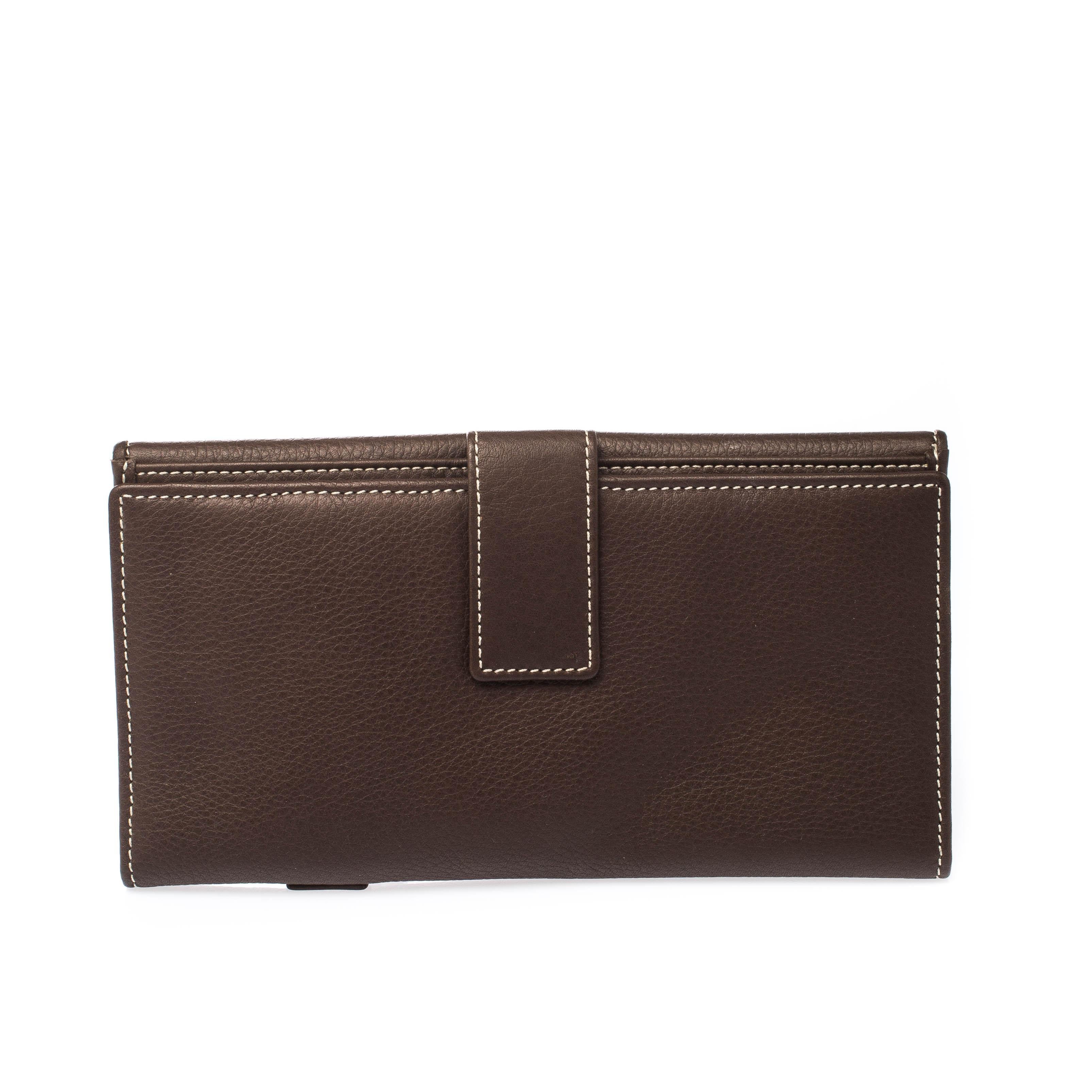 Take this spacious and functional wallet by Dior everywhere. Crafted from leather, this front flap wallet is accented with a gold-tone D. The easy to organize interior features open compartments and card slots.

Includes: The Luxury Closet