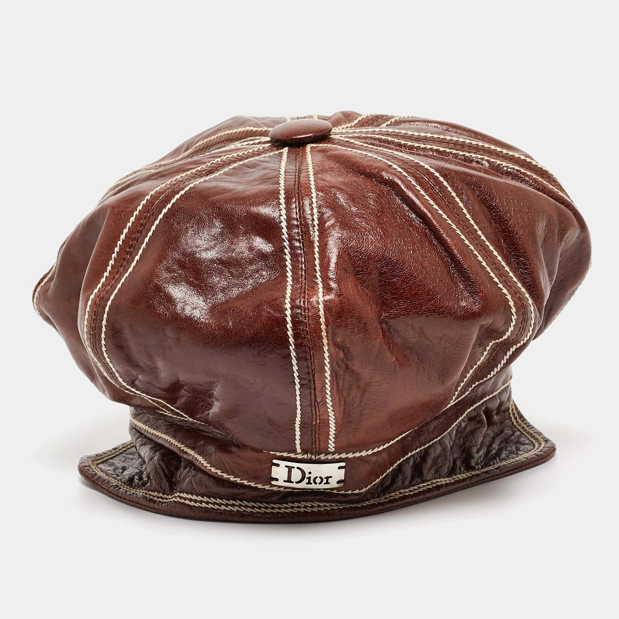 Put the finishing touch to your outfit with this newsboy cap by Dior. This brown cap is made from leather and features the brand name on the back.

