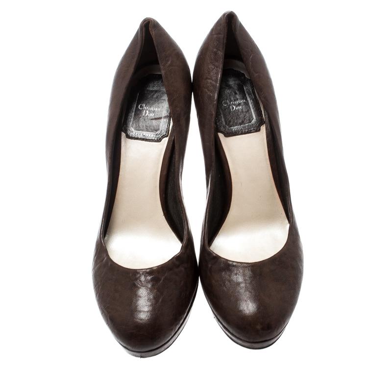 Match your handbag with this pair of leather pumps for an elegant look. Nail the chic look by enhancing your outfit with this pair of Dior pumps. Make a stunning style statement while flaunting this pair of lovely brown pumps.

Includes: Original