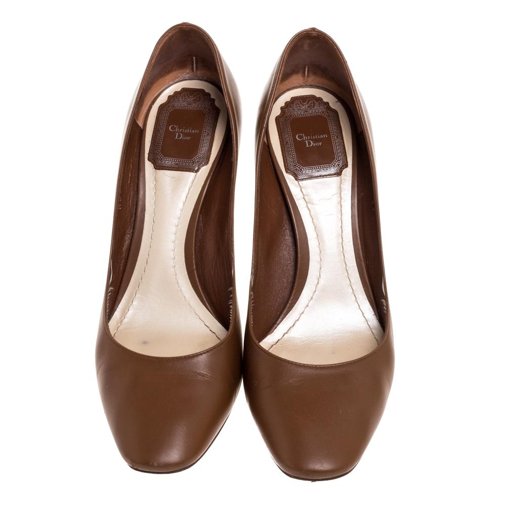 With this one, Dior has brought yet another comfortable pair of pumps. The leather body of these pumps looks absolutely amazing. Subtle and stylish, this pair of brown pumps are complete with crackled leather block heels.

Includes: Original Box
