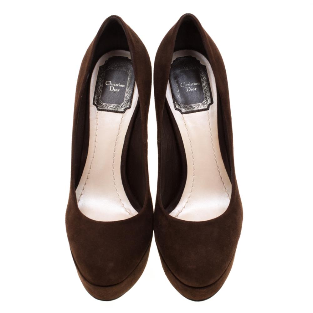 These pumps from Dior are simply irresistible. The gorgeous brown pumps are crafted from soft suede and feature round toes. They come equipped with leather lined insoles, 13 cm heels with silver-tone 'CD' initials detailed on the counters and solid