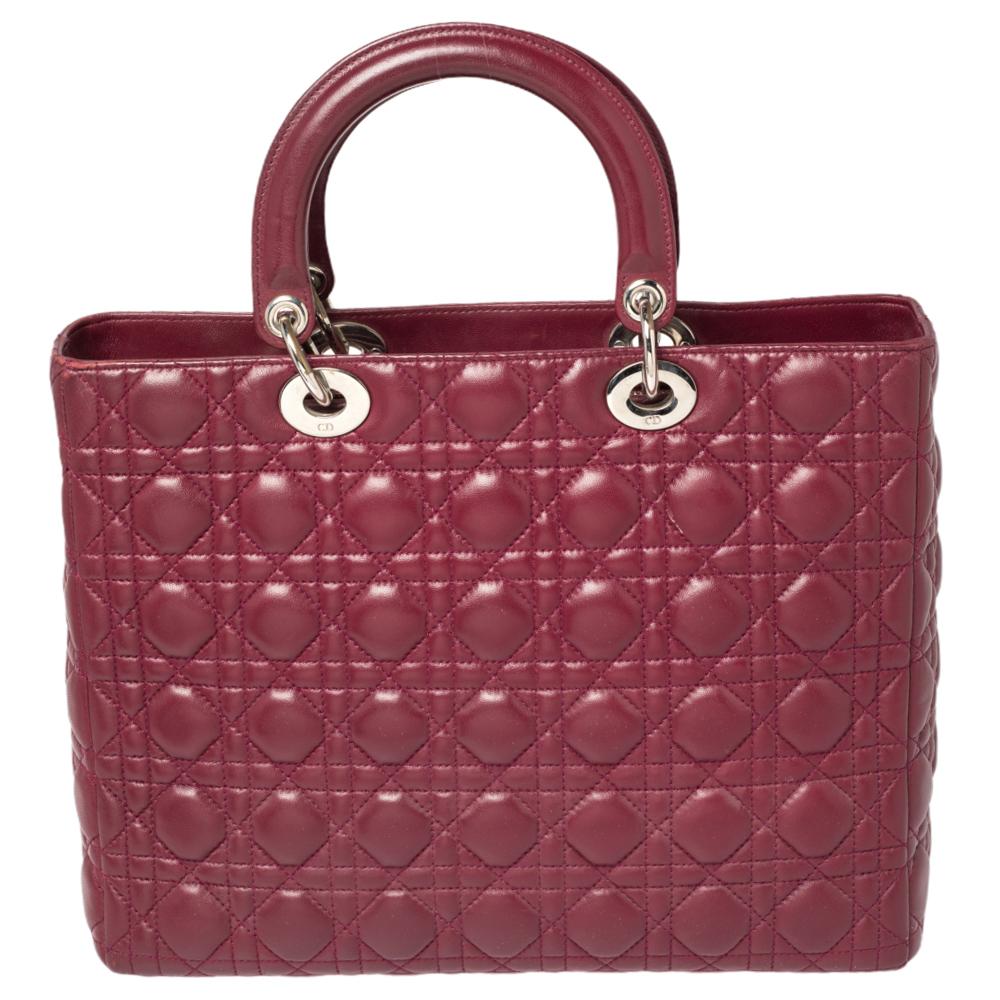 The Lady Dior tote is a Dior creation that has gained recognition worldwide and is today a coveted bag that every fashionista craves to possess. This burgundy tote has been crafted from leather and it carries the signature Cannage quilt. It is