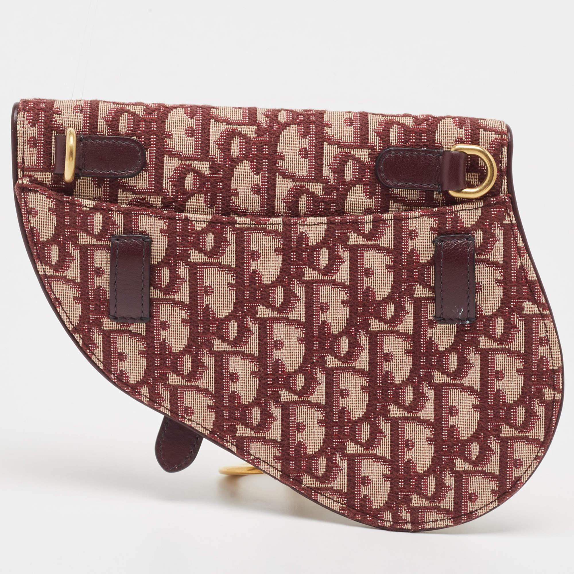 Designed to be carried around the waist, this Saddle belt bag by Dior speaks of all things being fashionable. It is made from Oblique canvas and designed in the likeness of the brand's famous Saddle bag.

Includes: Info Card