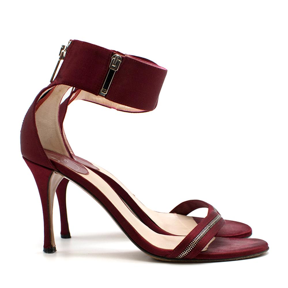 Dior Red Satin Heeled Sandals with Sliver Zip Details 

- Leather Sole 
- Zip Details around toe and Ankle 
- Round-Toe
- Satin Ankle Strap

Made in Italy 

Please note, these items are pre-owned and may show signs of being stored even when unworn