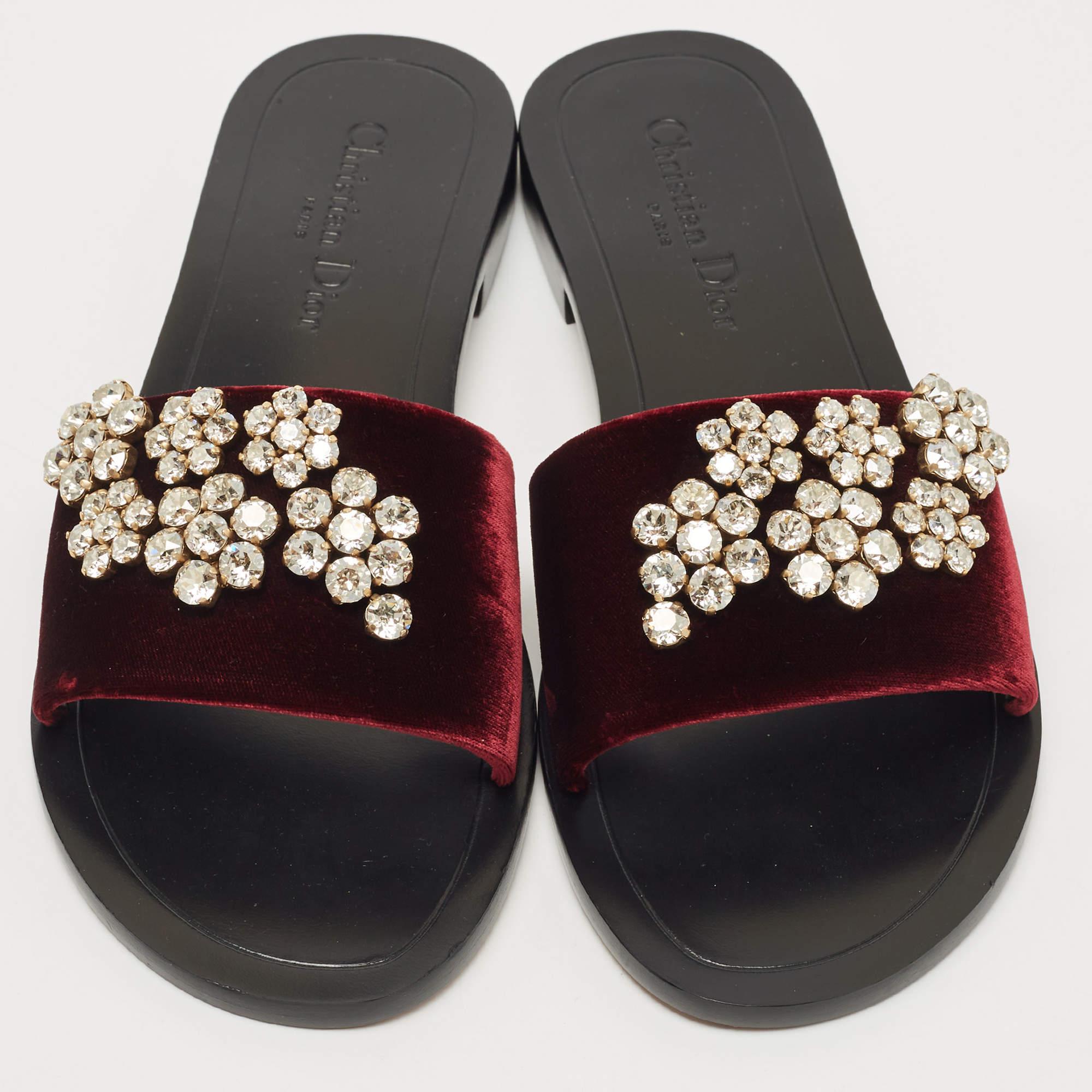 Dior's collections are a testament to the label's opulent and glamorous aesthetics. Crafted from velvet in a burgundy shade, the flats are decorated with crystal embellishments. They will look stunning with dresses.

