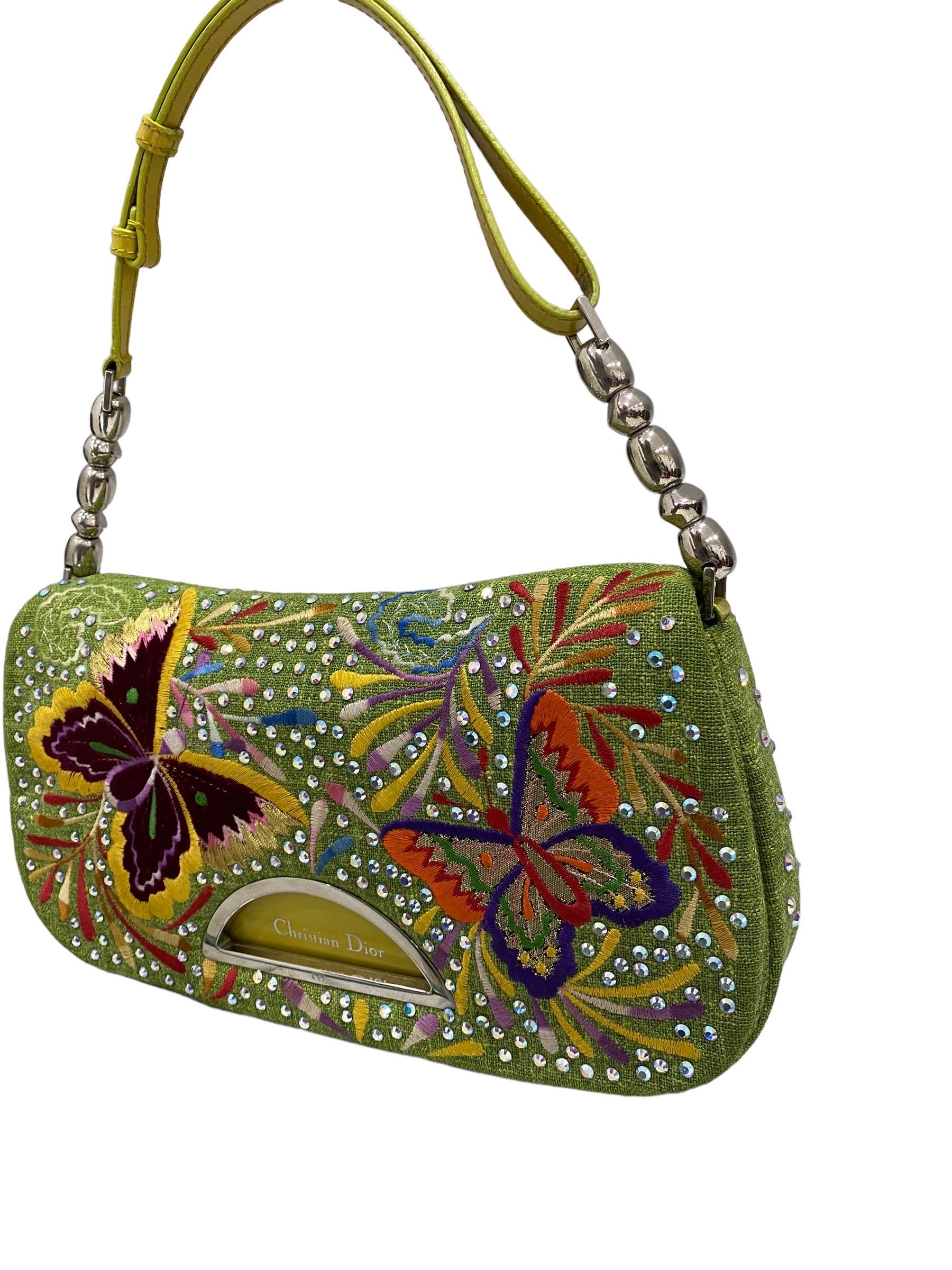 Dior bag, Butterfly Crystal Malice model, 2001 edition, made of green fabric with raised embroidery and rhinestones. Equipped with a flap with magnetic closure, internally lined in green satin, roomy for the essentials. Equipped with an adjustable