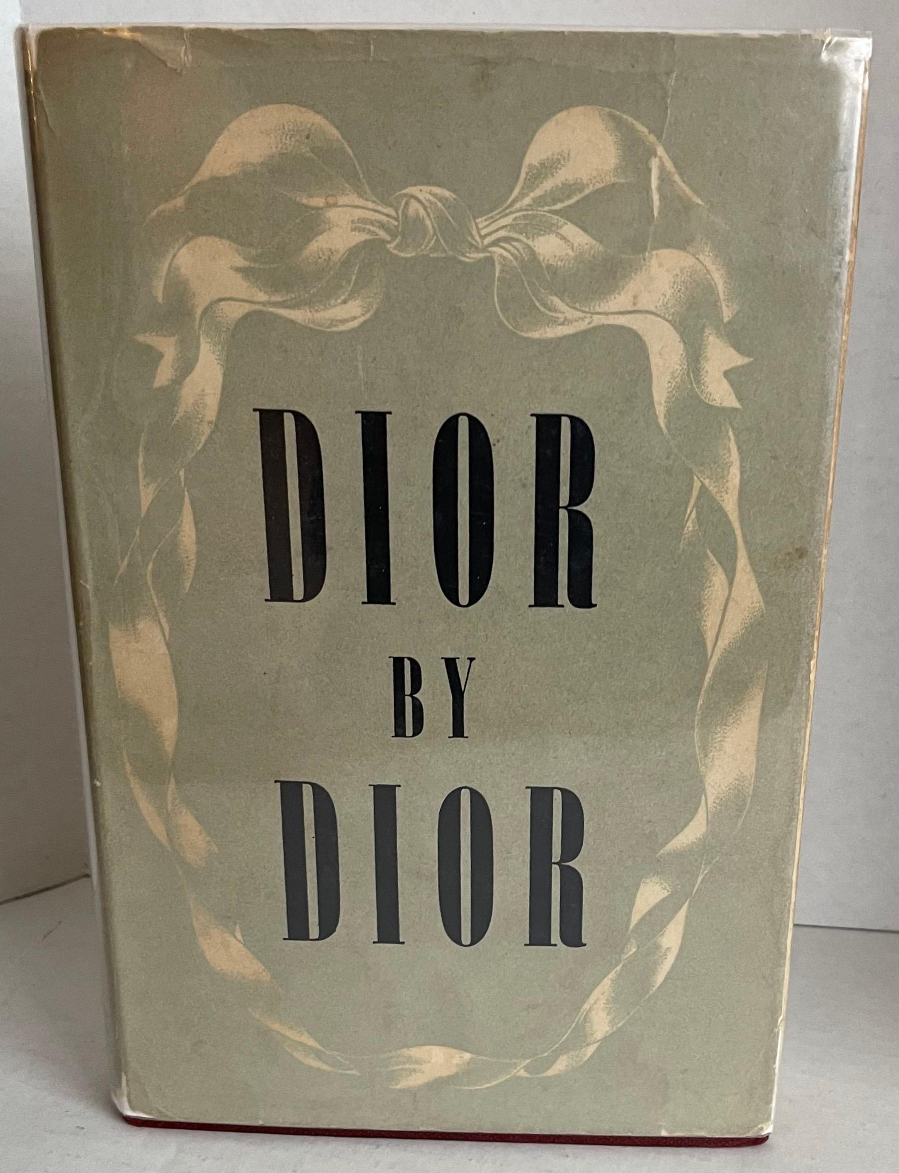 Dior by Dior the Autobiography of Christian Dior 1957 English Ed.  Featuring four distinct sections  - The Birth of Maison Christian Dior; From the Idea to the Dress; Inside a Couture House; The Adventure of My Life. 
Clear Mylar jacket has been