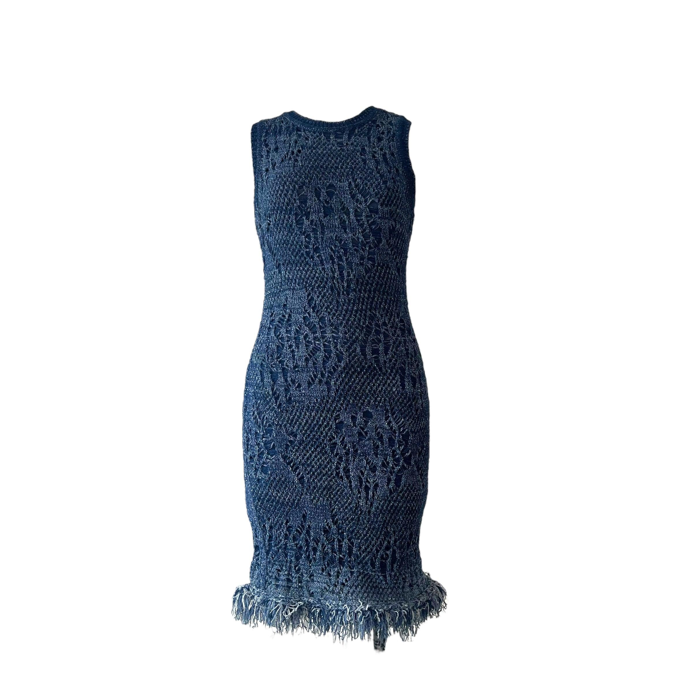 Introducing the iconic Christian Dior blue open-knit bodycon dress from the Spring-Summer 2000 collection, meticulously crafted by the visionary designer, John Galliano. This knee-length dress features a crew neck and incorporates various knitted