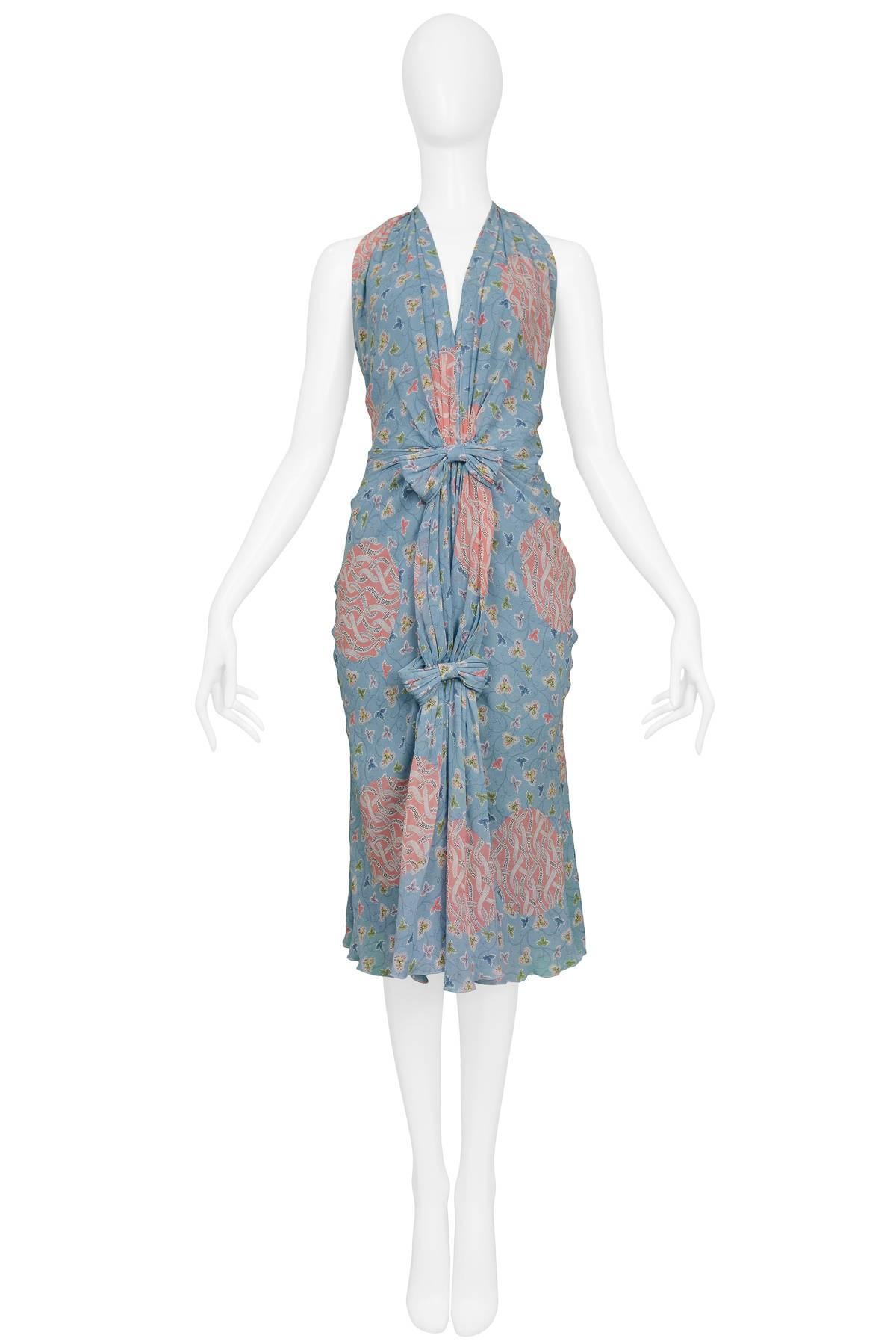 CHRISTIAN DIOR
BLUE AND MAUVE FLORAL PRINT HALTER DRESS
Condition : Excellent Vintage Condition
Size : 36

Christian Dior by John Galliano Pleated Fan Dress w Halter Neck & Open Back. Dress features light blue background with pink floral print,