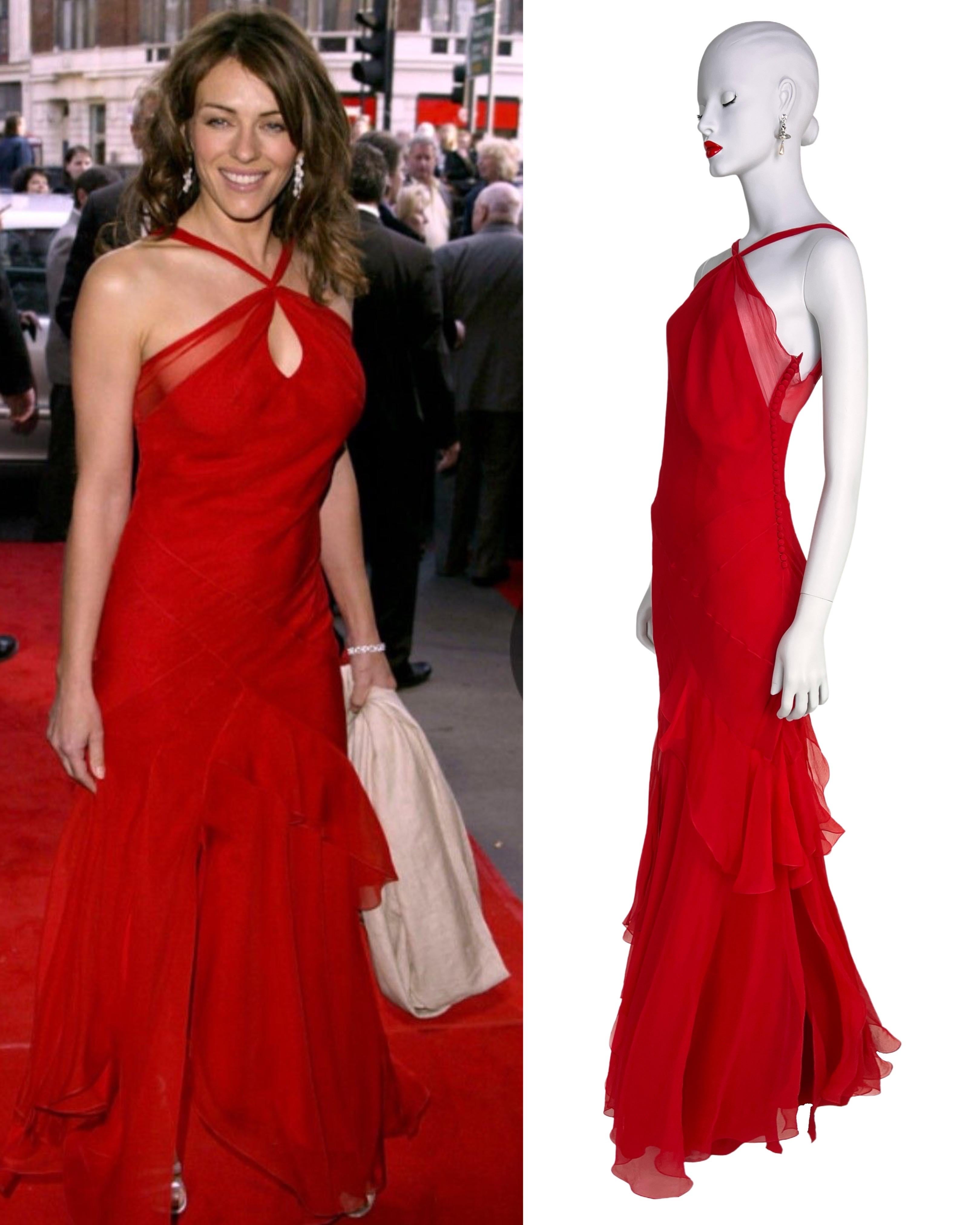 Designed by John Galliano, we introduce this stunning, flowing asymmetrical dress, as seen on Elizabeth Hurley in 2005. The skirt has slits of various height, which creates a lot of movement of the dress.

Size label is missing, but the fit