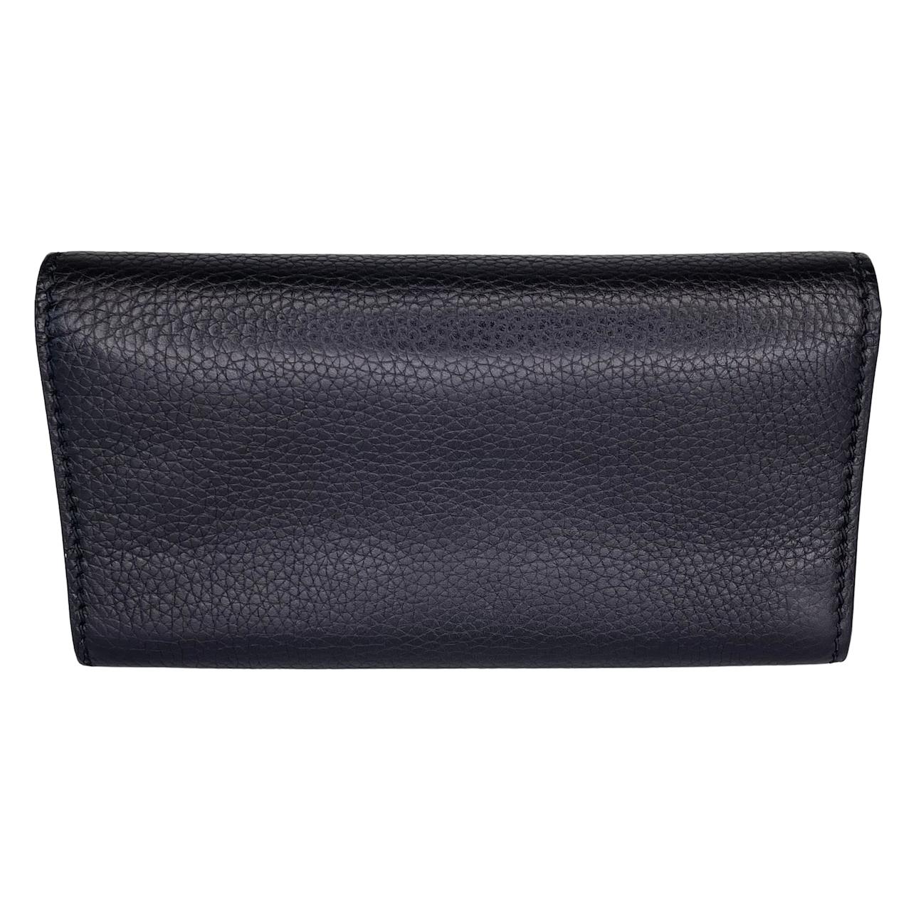 This wallet is made from calfskin leather in black. The wallet features a gold press lock, and a gold J'ADIOR on the front flap, a smooth black leather interior with patch packets and a zipper pouch.

COLOR: Black 
MATERIAL: Calfskin leather
ITEM