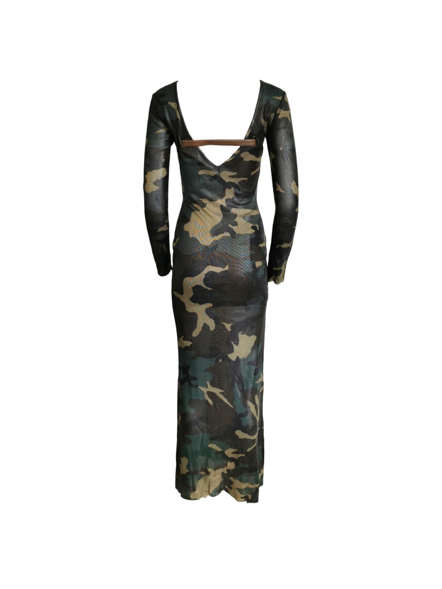 Christian Dior by John Galliano Camouflage dress, a daring but casual look. This dress features long sleeves, a deep V neckline, perfectly complemented by high splits on each side, adding a touch of spice. The captivating camouflage pattern, adorned