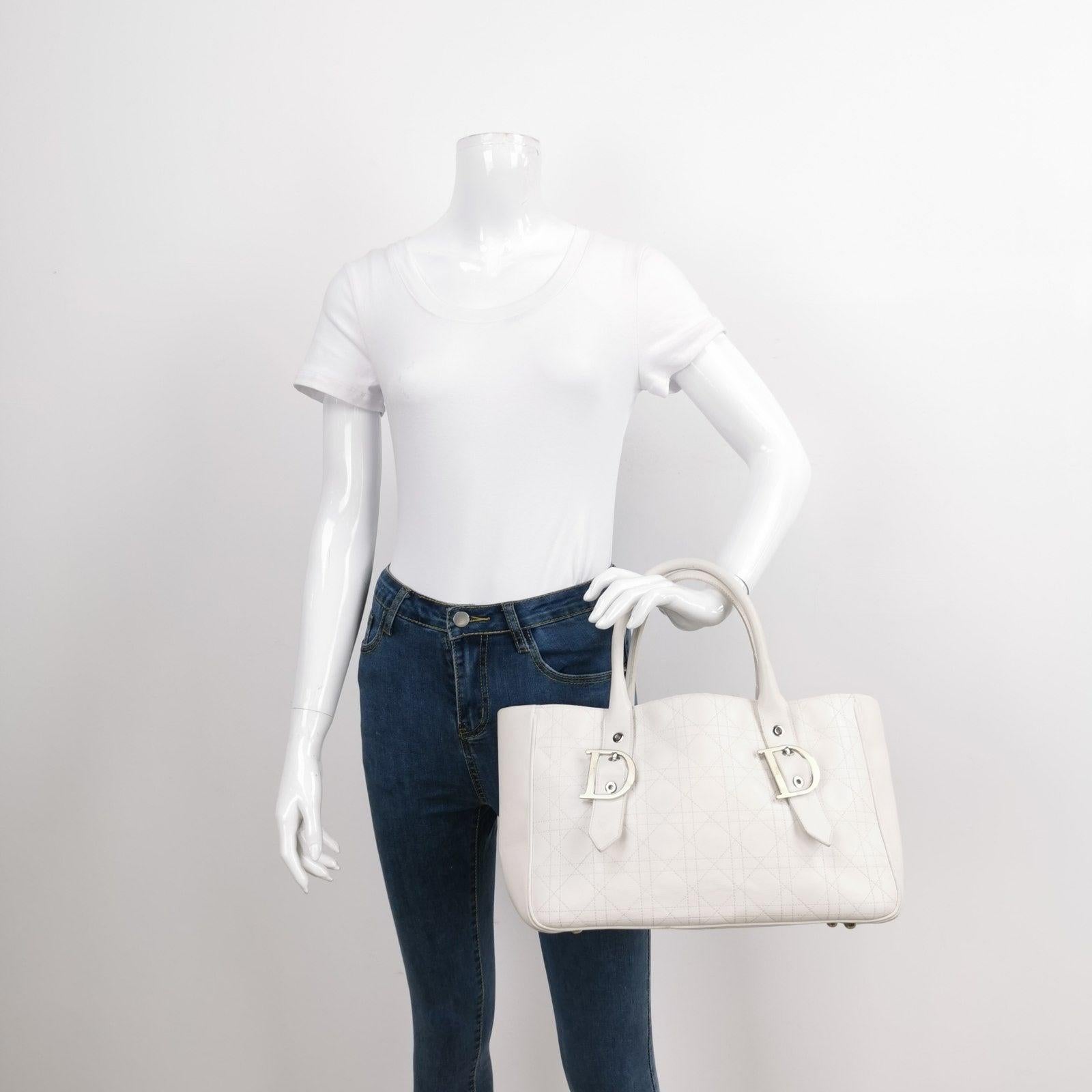 Dior Cannage Leather Tote Bag White 2005 with Silver Hardware These are professional photos of the actual bag. Expertly designed for the modern woman, this Dior tote bag in white leather features the iconic cannage stitch and is perfect for both a